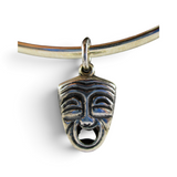 Brocosi.com vintage sterling silver comedy tragedy theater mask charm with antiqued finish on a silver bracelet