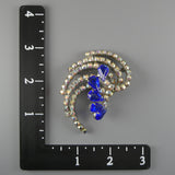 Vintage 1950s Swirling Comet Brooch with Aurora Borealis and Blue Rhinestones