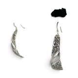 Brocosi.com sterling silver dangle earrings featuring a curved Victorian scroll design on a black display stand.