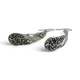 Brocosi.com sterling silver dangle earrings featuring a detailed Victorian-inspired curved scroll design.